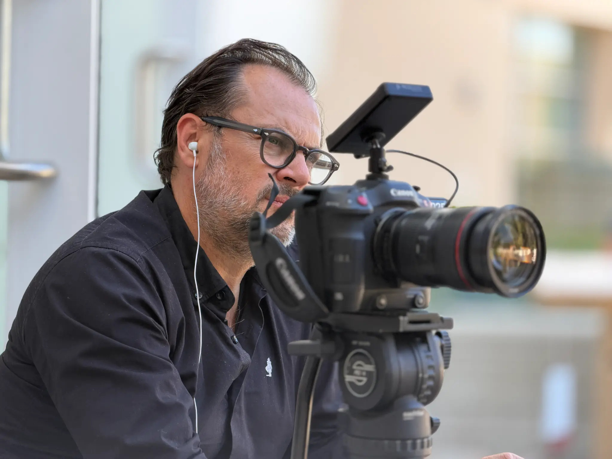 Patrice Knanec directing behind a camera